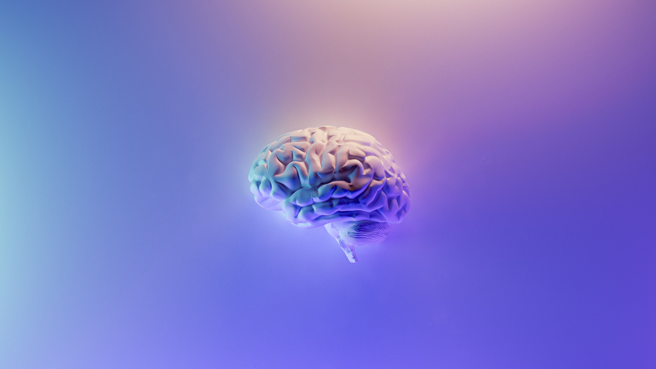 An illustration of a brain centred on a purple, blue and yellow background